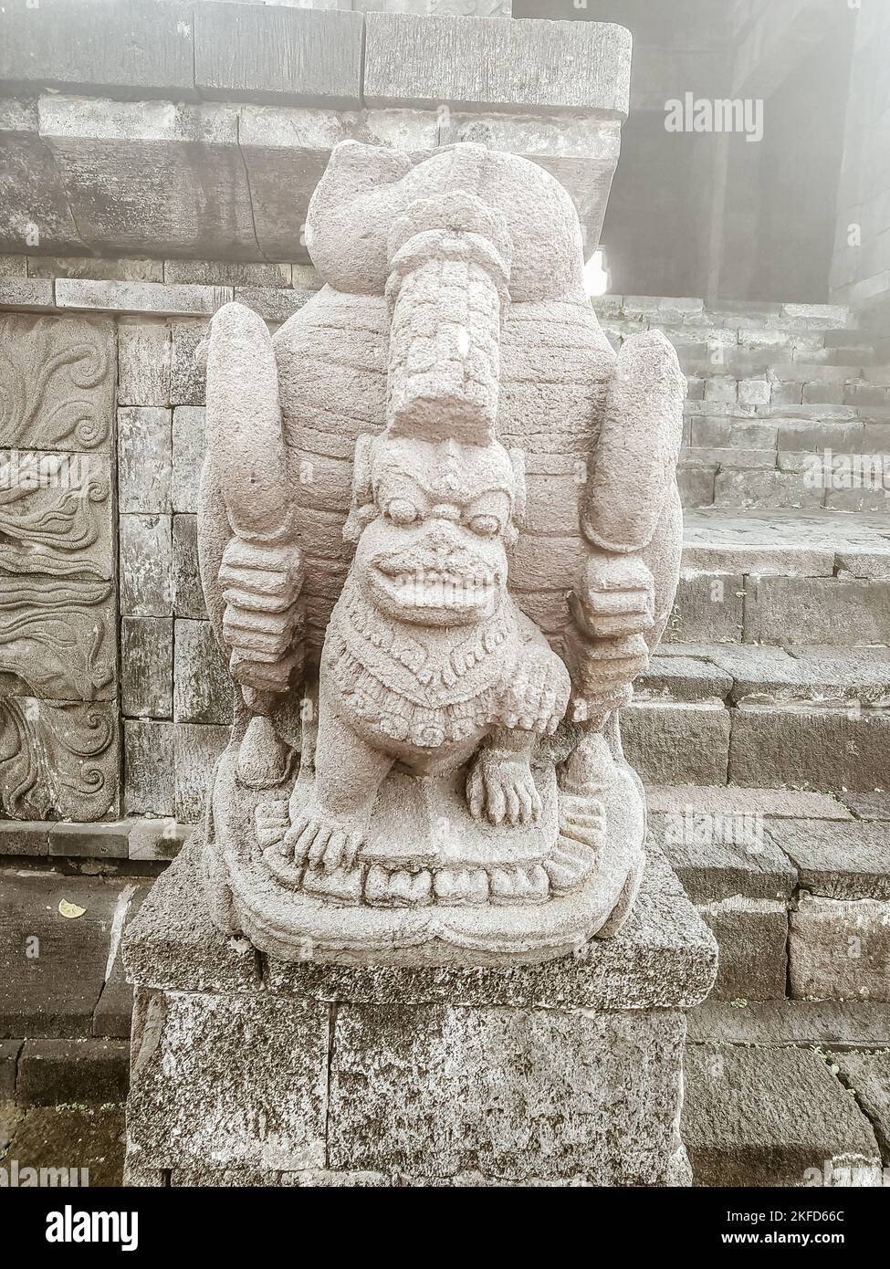 A vertical shot of an ancient makara statue in  yogyakarta, indonesia Stock Photo