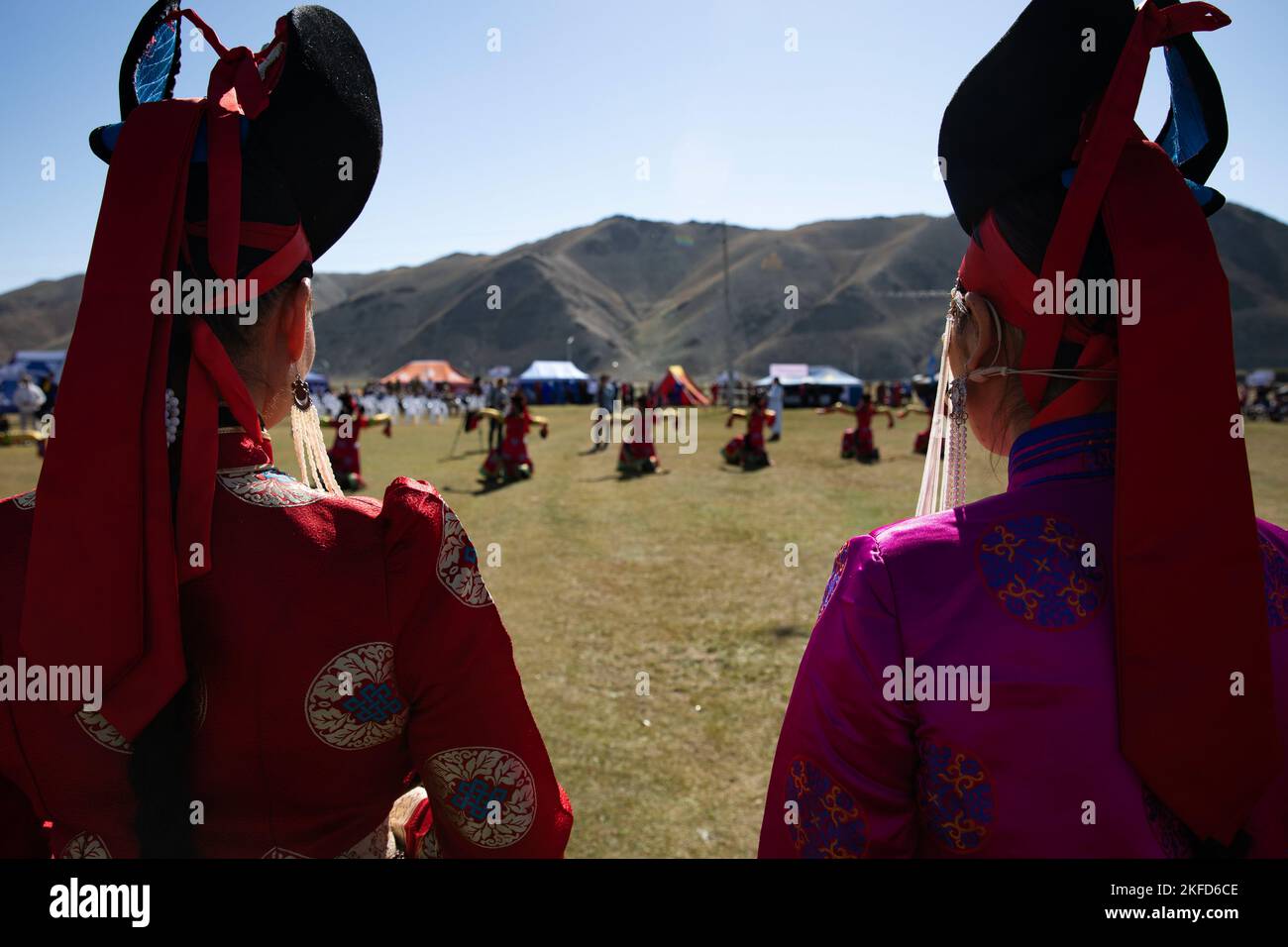 Mongolian performers in traditional dress, known as a Deel, dance for the opening of a Naadam festival held before the last day of field training exercises for Gobi Wolf 2022 in Bayankhongor, Mongolia, Sept. 9. Gobi Wolf is a disaster response exercise designed to test processes while maximizing realism through a series of scenarios. Participating countries also include Bangladesh, Nepal, Sri Lanka, Thailand, the United Kingdom and Vietnam. (Alaska National Guard photo by Victoria Granado) Stock Photo