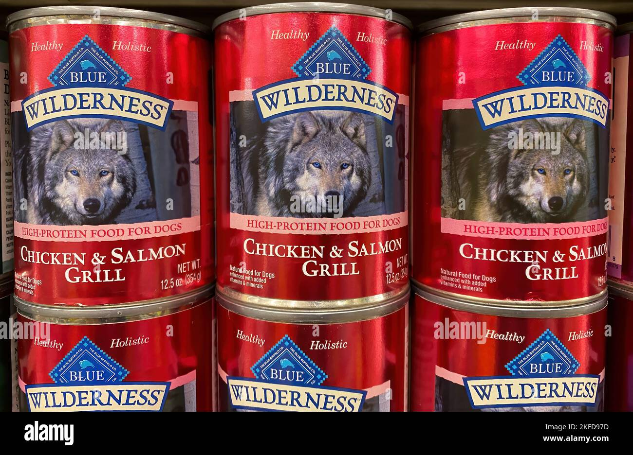 A closeup shot of canned dog food on display at a grocery store Stock