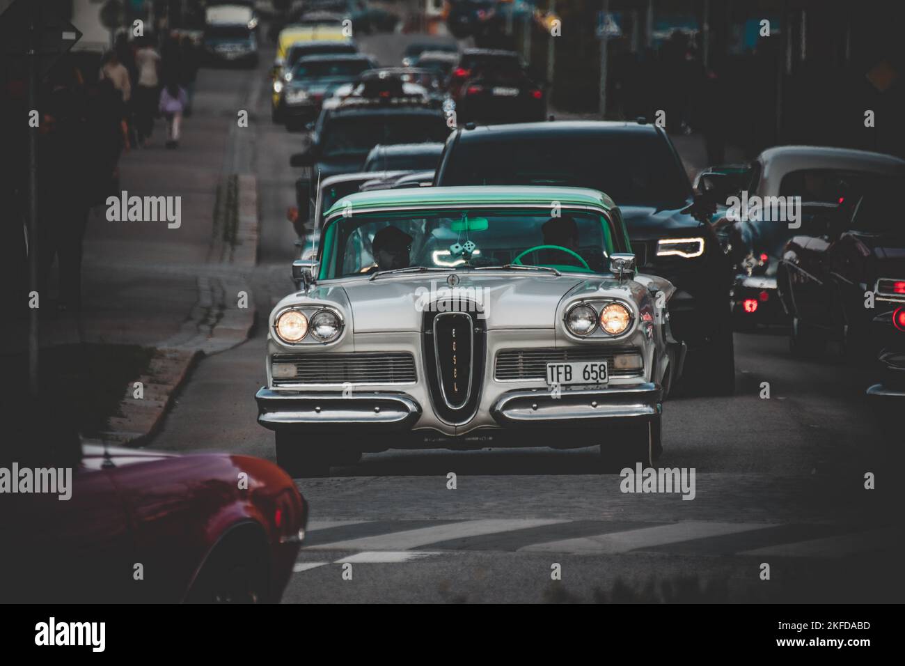 A line of old cars Cruising in Nybro city Sweden  during the Reggae event Stock Photo