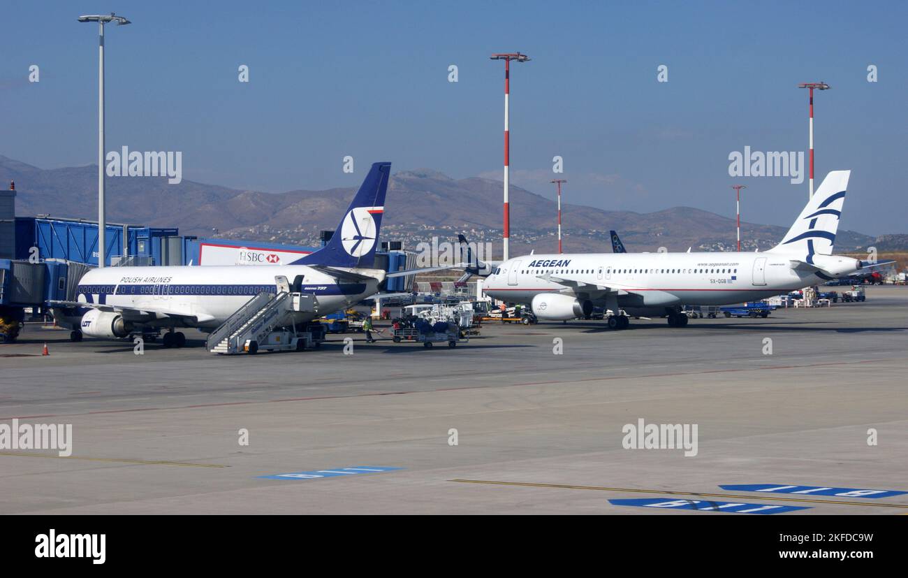 LOT Boeing 737 and Aegean Airlines Airbus A320-232 at the terminal of Athens International Airport, Athens, Greece Stock Photo