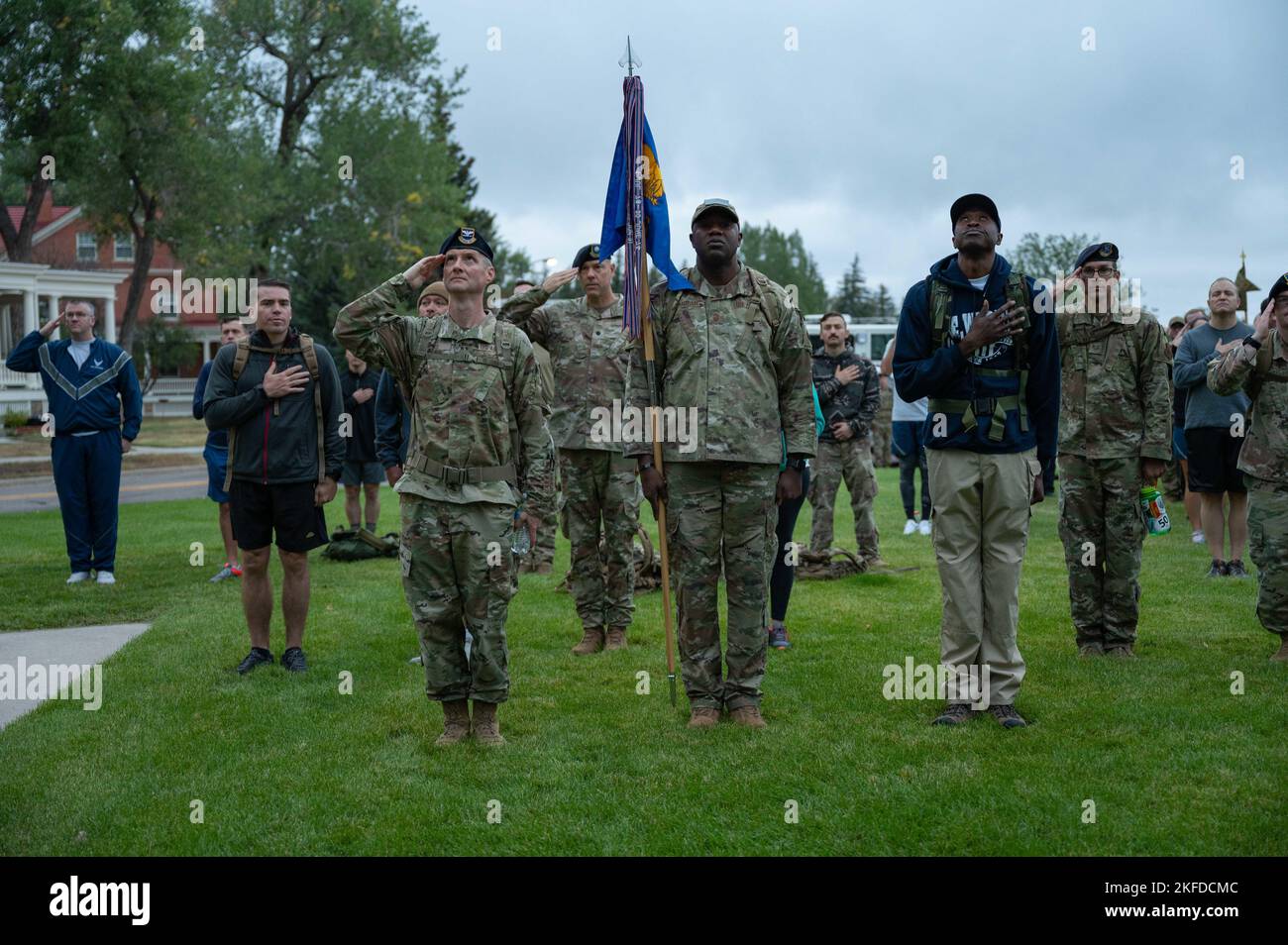 Mighty Airmen salute the flag for the national anthem during a 9