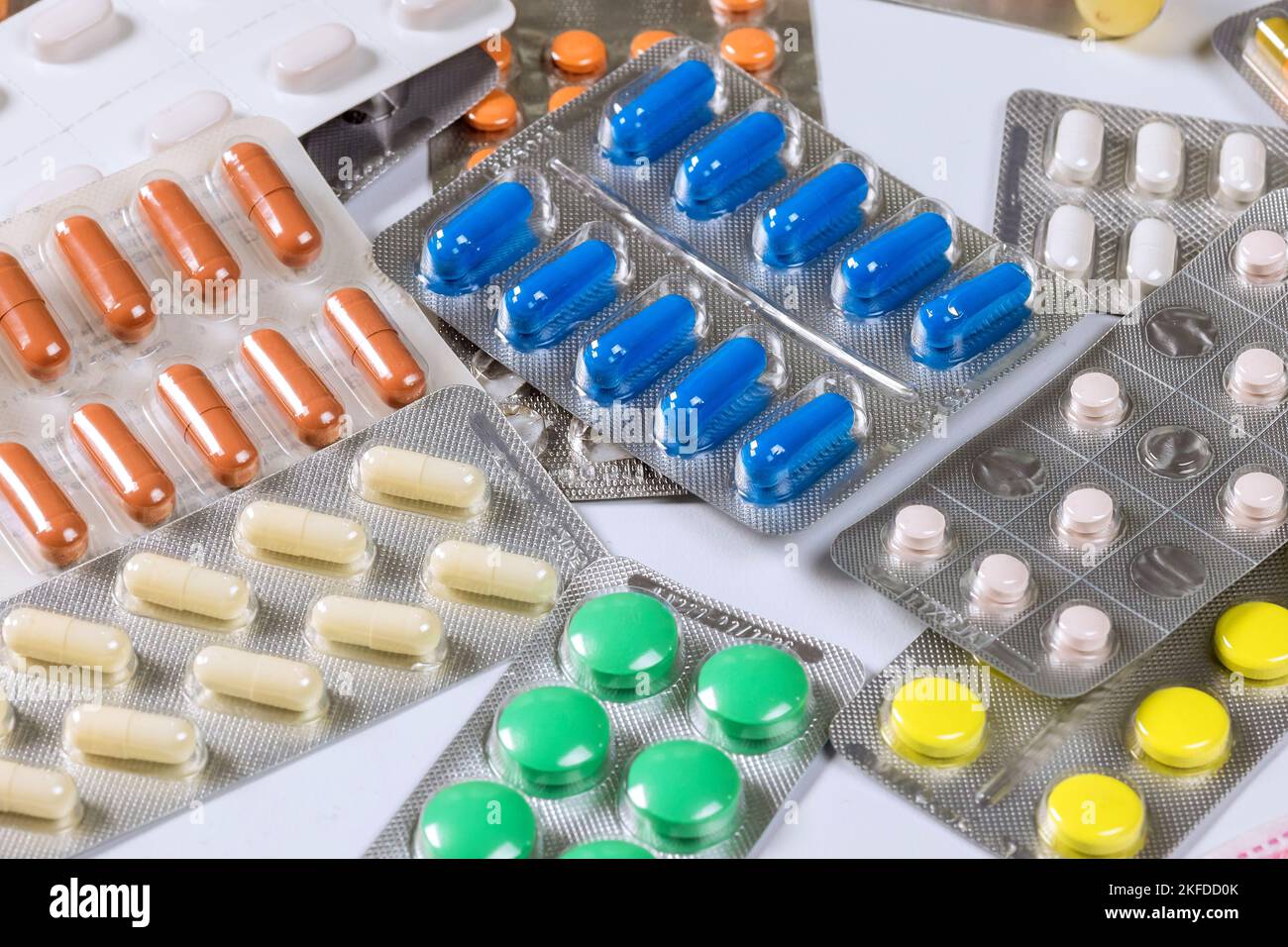 Various pills are on table in medical office doctor Stock Photo