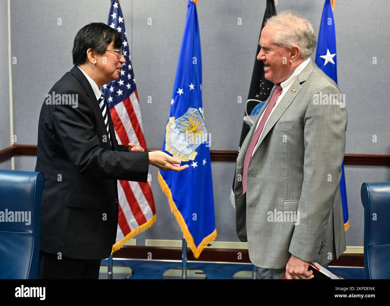Secretary of the Air Force Frank Kendall, right, greets Hideki ...