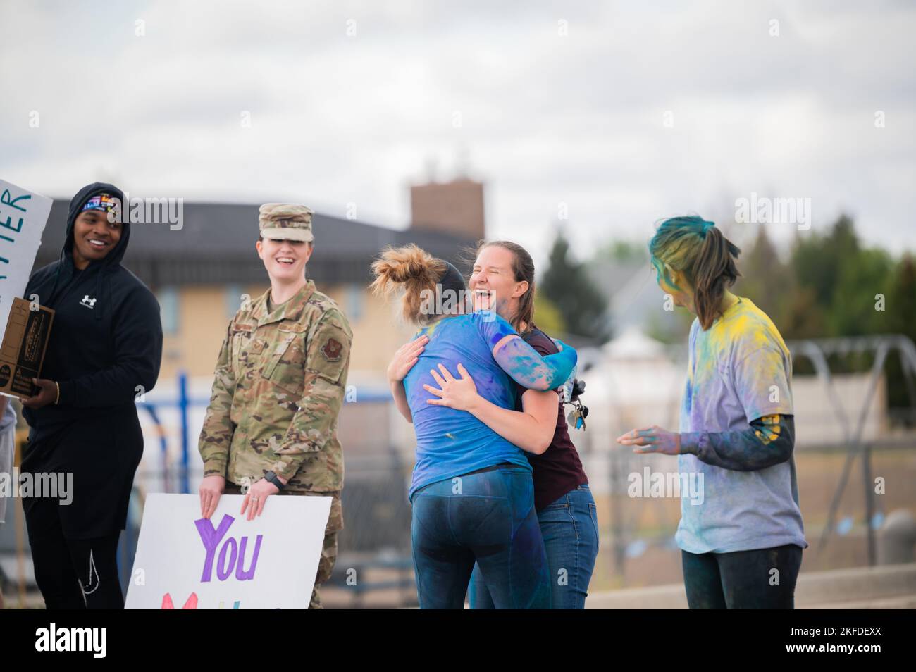 Col. Corrie Pecoraro, 341st Force Support Squadron commander, hugs Serena Sargent, 341st Missile Wing violence prevention integrator, after crossing the finish line during a Suicide Awareness Color Run Sept. 9, 2022, at Malmstrom Air Force Base, Mont. The run was organized to share messages of hope, increase resilience and provide information about available resources. Stock Photo