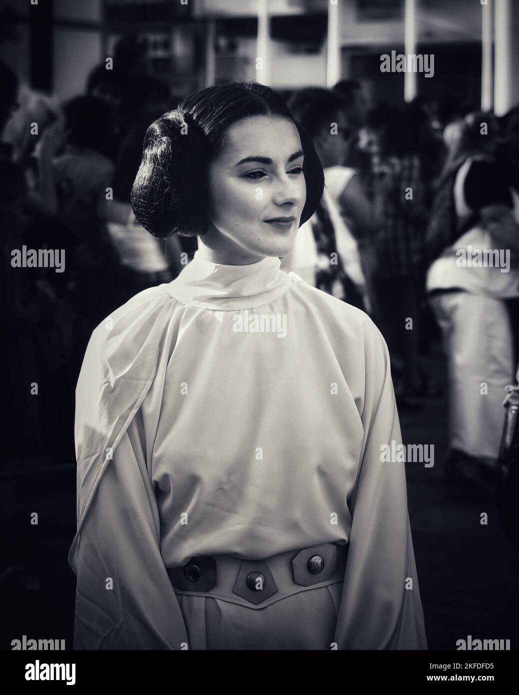 A grayscale of a girl cosplaying Princess Leia from Star Wars at Fantasy fest Fuenlabrada Stock Photo