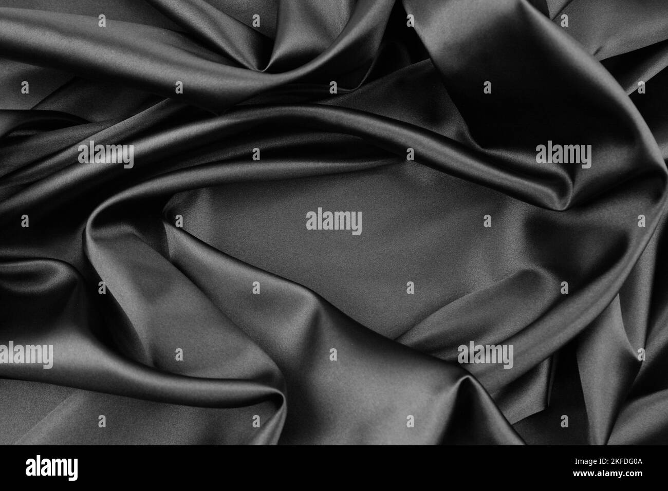 Closeup of rippled black silk fabric Stock Photo