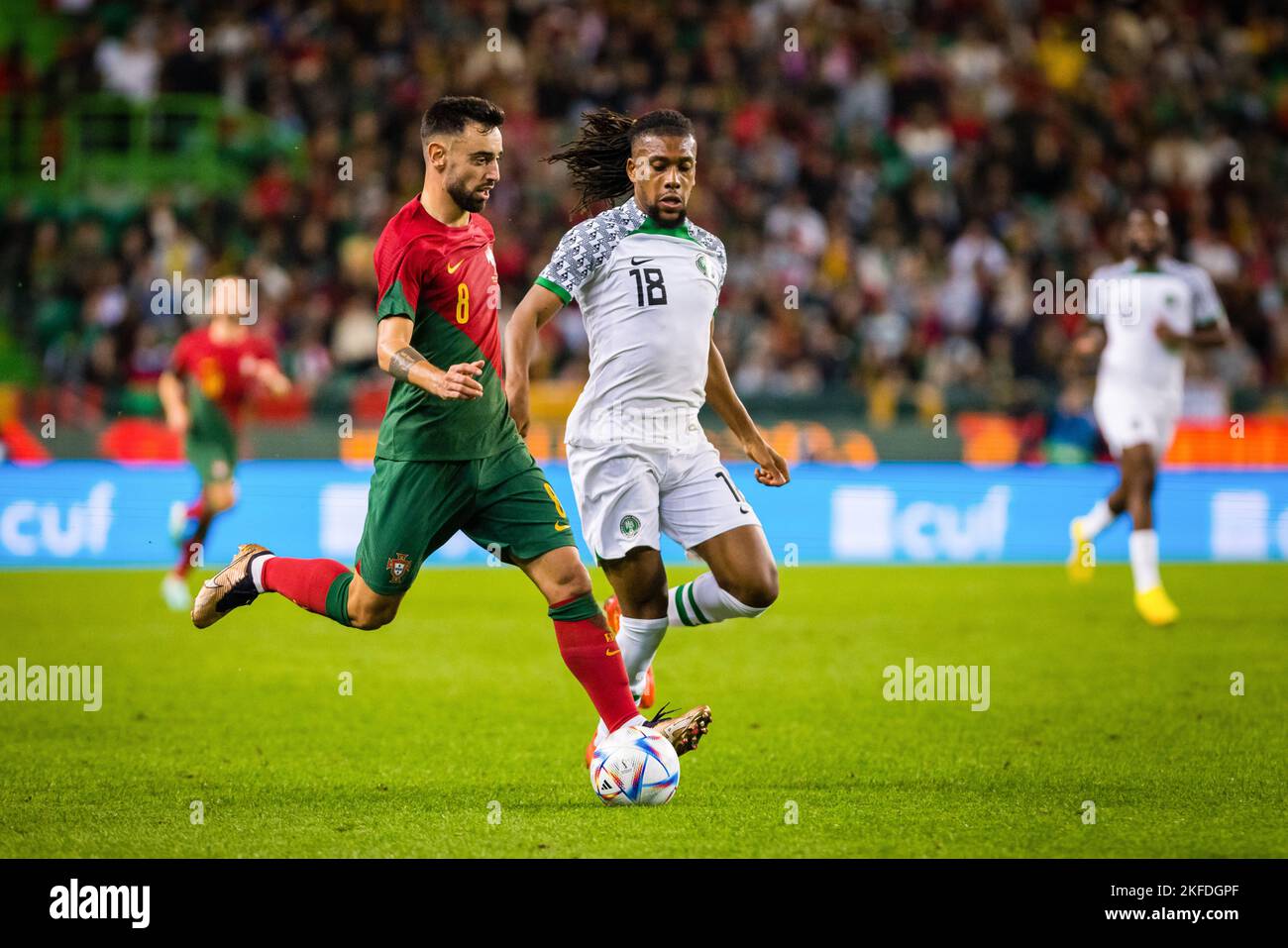 Lisbon, Portugal. 17th Nov, 2022. Bruno Fernandes of Portugal (L) and Alex Iwobi of Nigeria (R) seen in action during the friendly football match between Portugal and Nigeria, at the Jose Alvalade stadium ahead of the Qatar 2022 World Cup. (Final score: Portugal 4 - 0 Nigeria) Credit: SOPA Images Limited/Alamy Live News Stock Photo