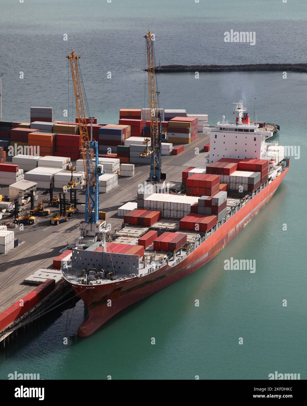 A container ship unloading at port in Napier - New Zealand Stock Photo ...