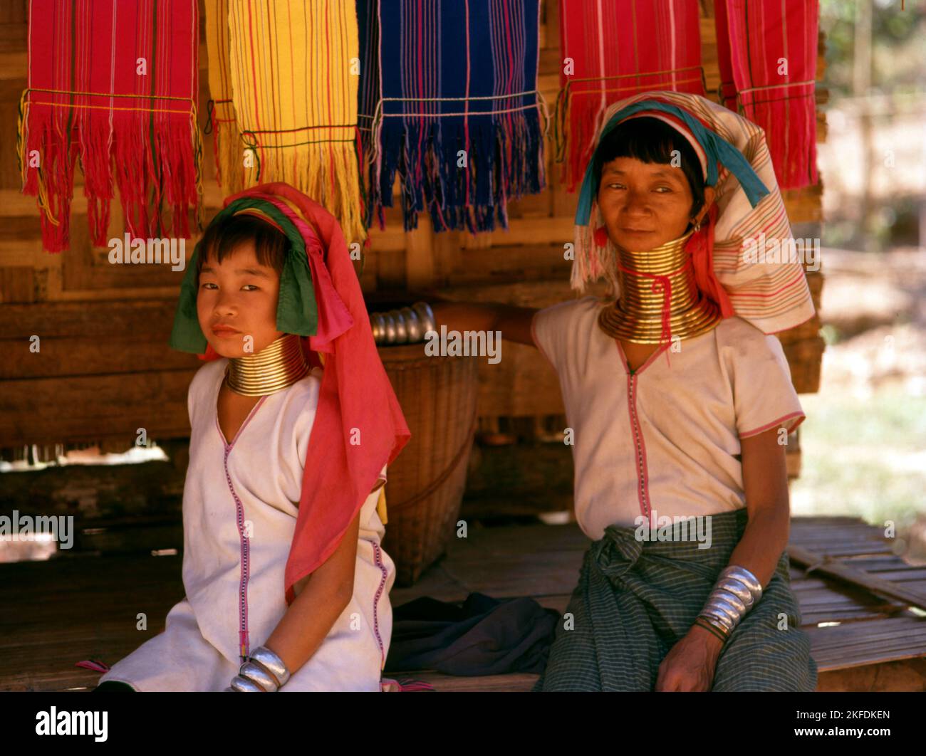 Thailand: Padaung (Long Neck Karen) woman and child, village near Mae Hong Son. The Padaung or Kayan Lahwi or Long Necked Karen are a subgroup of the Kayan, a mix of Lawi, Kayan and several other tribes. Kayan are a subgroup of the Red Karen (Karenni) people, a Tibeto-Burman ethnic minority of Burma (Myanmar). Stock Photo