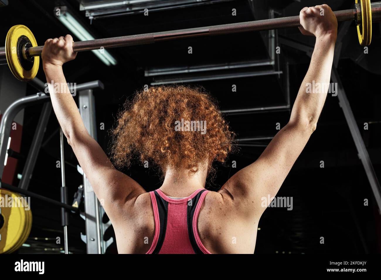 Woman bodybuilder engaged with a barbell in the gym Stock Photo - Alamy