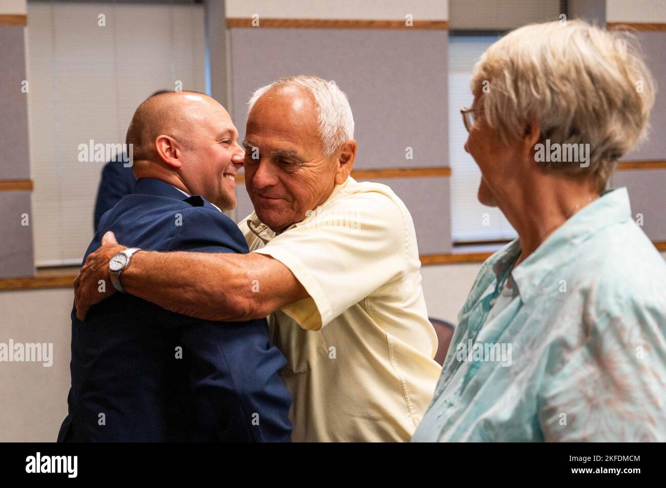 U.S. Air Force Lt. Col. Aaron Larimore, Missouri Air National Guard, hugs his father during his change of command ceremony at Rosecrans Air National Guard Base, St. Joseph, Missouri, Sept. 10, 2022. Larimore became the commander of the 139th Communications Flight. Stock Photo