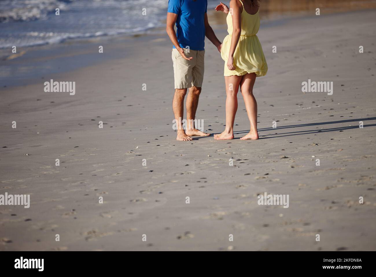 Enjoying the beach. an affectionate couple on the beach. Stock Photo