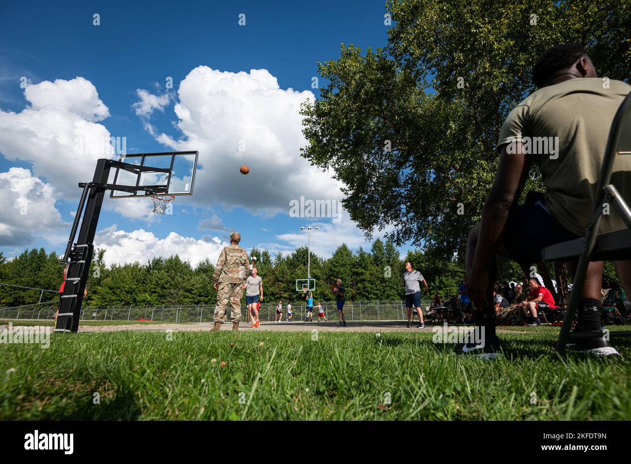 Air Force Lt. Col. Rick Wood, the acting 181st Mission Support Group commander, watches a three-point shot during a basketball shooting competition at Hulman Field Air National Guard Base, Ind., Sept. 10, 2022. The competition was part of a larger basketball tournament meant to promote fitness and camaraderie. Stock Photo