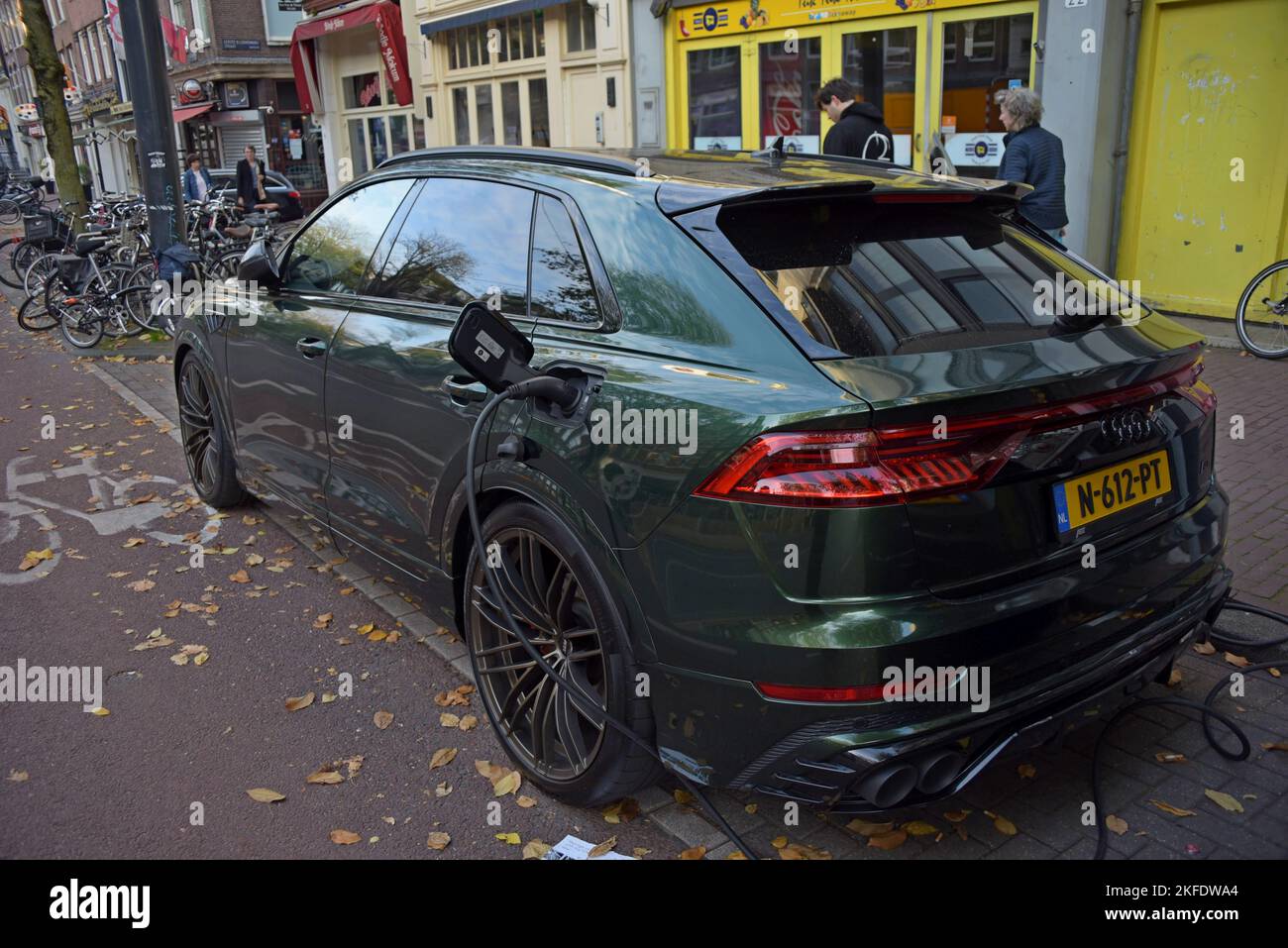An EV Audi electric car charging at an on street charging point