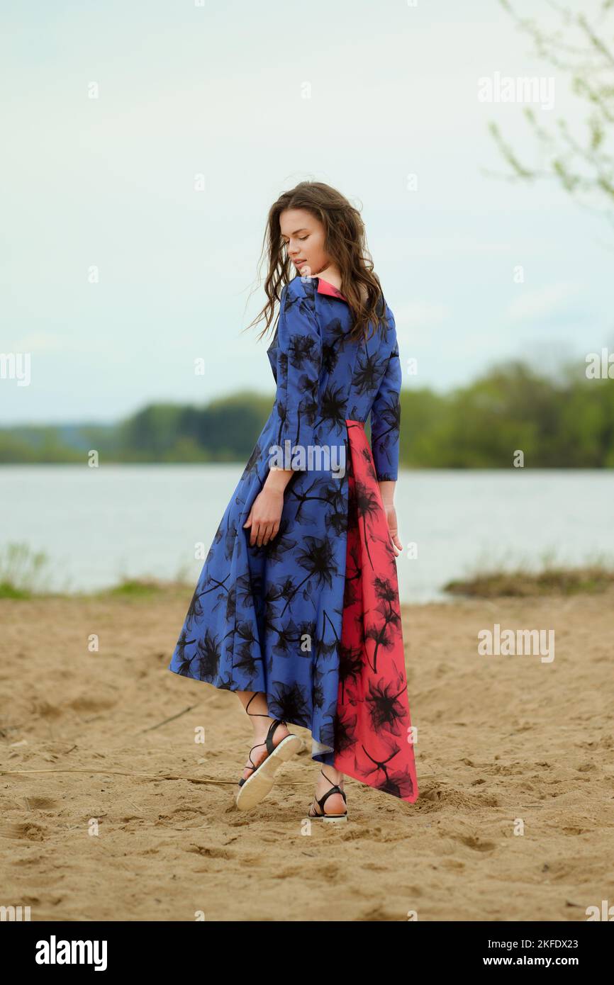 Woman walking beach alone dress hi-res stock photography and images - Alamy