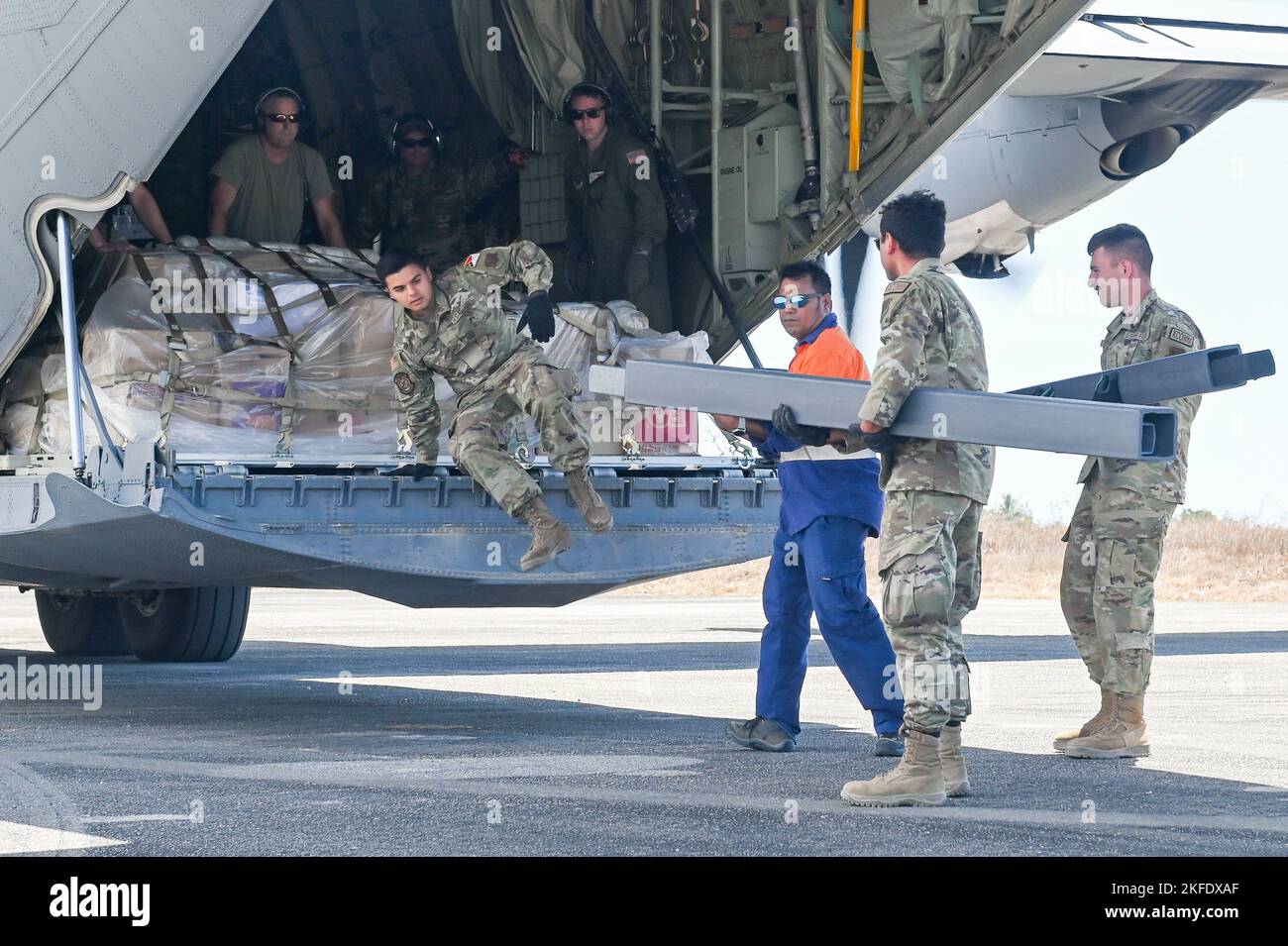 U.S. Air Force personnel offload medical supplies from a U.S. Air Force ...