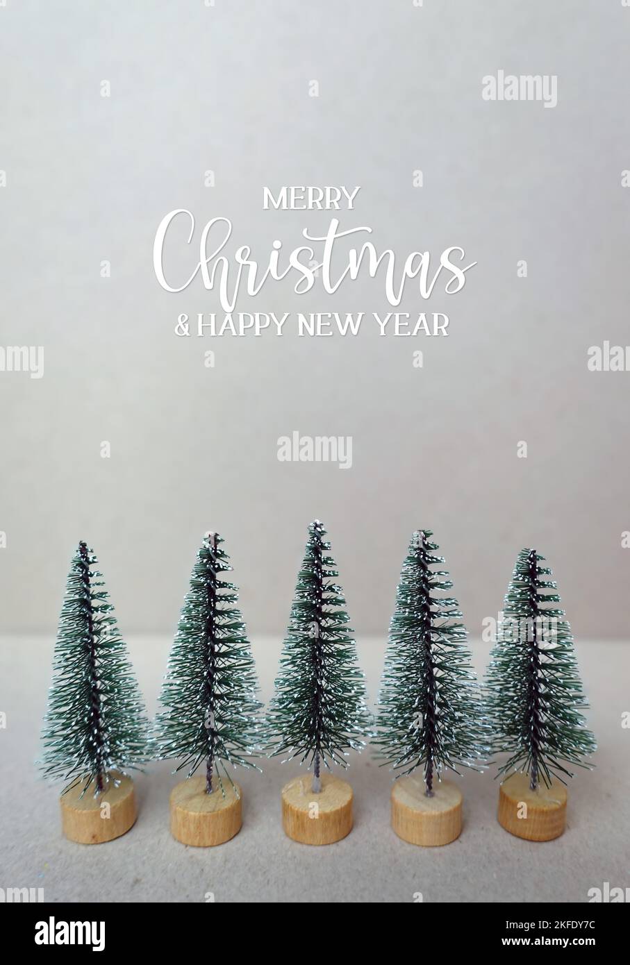 Merry Christmas and happy new year quote with miniature christmas trees
