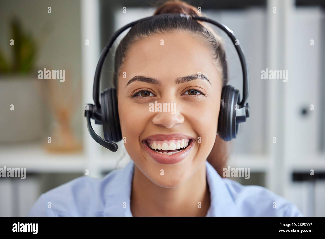 Call center, woman face and customer service, consulting and helping for solution, telemarketing or communication agency. Portrait of happy sales Stock Photo