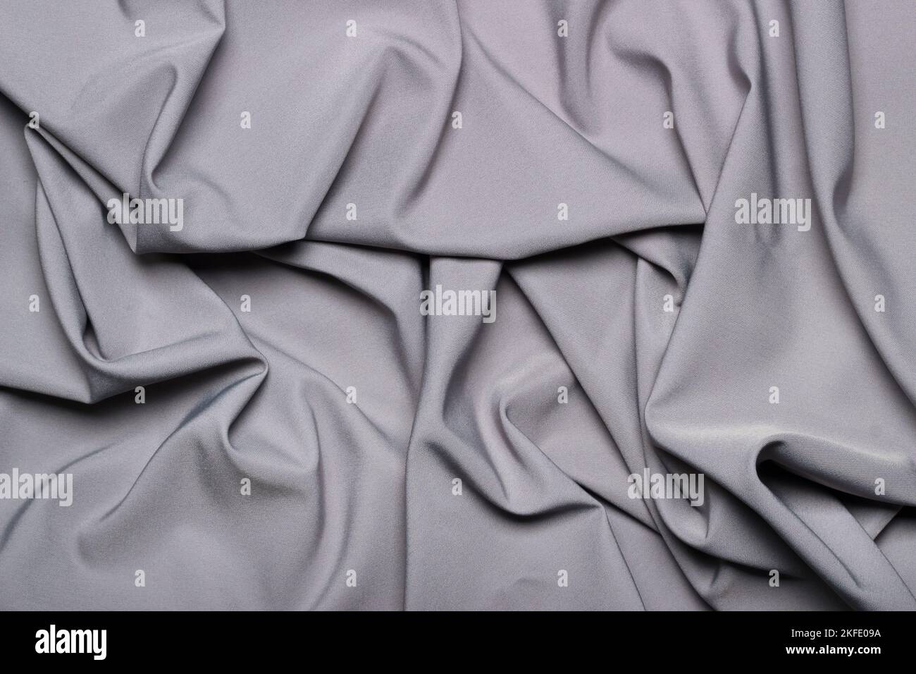 Crumpled silky gray fabric as background Stock Photo