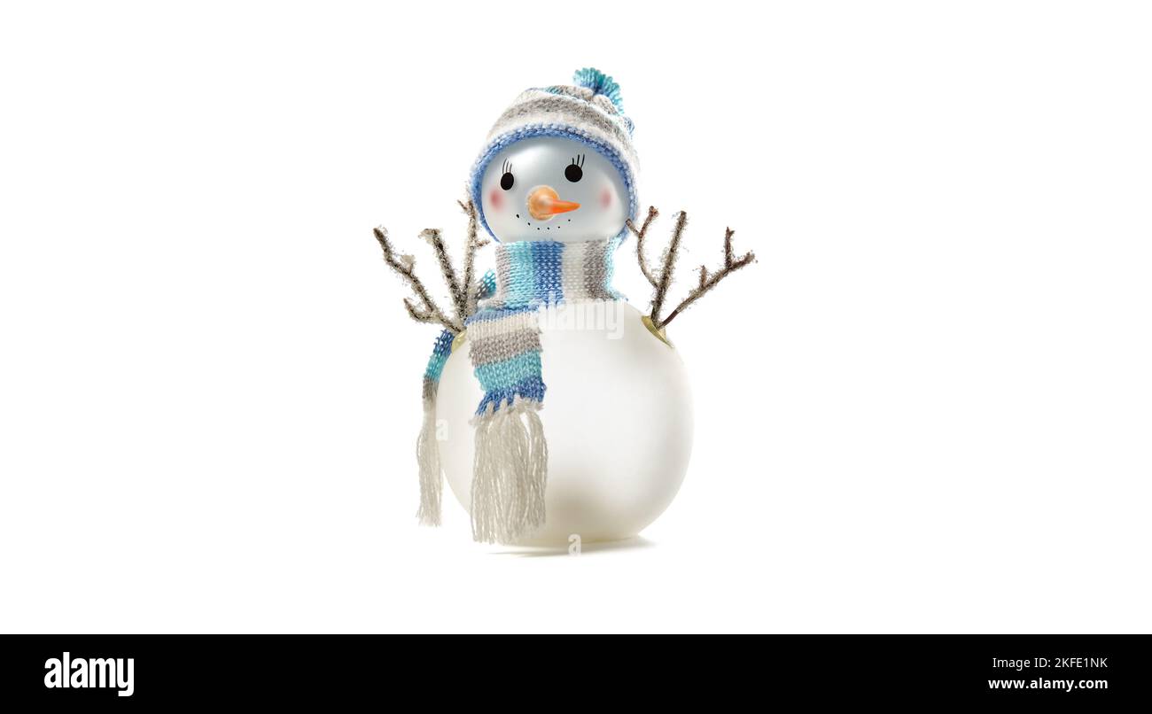 Snowman isolated on white background, copy space. Closeup of snowman wearing hat and scarf, christmas and new year celebration Stock Photo