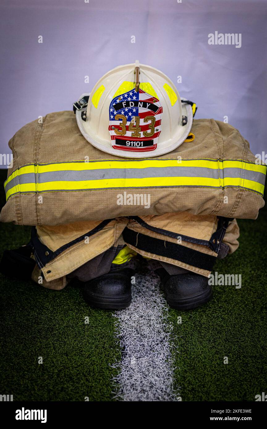 The 354th Civil Engineer Squadron displays firefighter turnout gear during the September 11th Remembrance Ceremony at Eielson Air Force Base, Alaska, September 11, 2022. The ceremony was dedicated to all the first responders, emergency medical services, firefighters and police, who gave their lives and worked to protect the victims of the terrorist attacks on September 11, 2001. Stock Photo