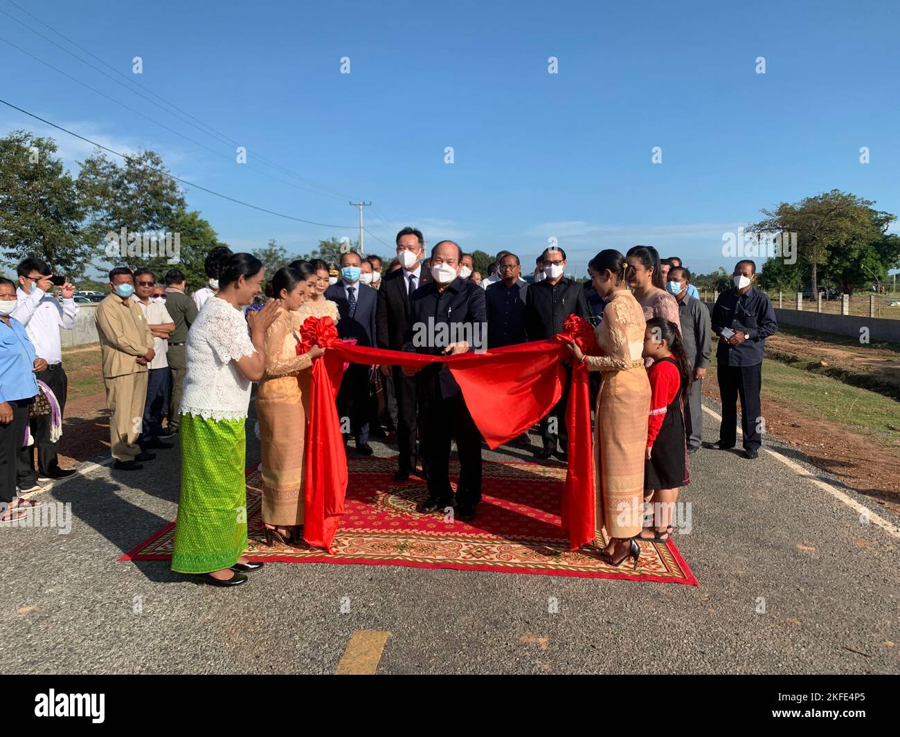 Kampong Chhnang, Cambodia. 17th Nov, 2022. Cambodian Minister of Rural Development Ouk Rabun (C front) cuts ribbon to inaugurate the China-aided rural road in Kampong Chhnang province, Cambodia, Nov. 17, 2022. The second phase of the China-aided rural road project in Cambodia has come to an end successfully, building asphalt and concrete paved roads in a total length of 120 km, officials said here on Thursday. Credit: Van Pov/Xinhua/Alamy Live News Stock Photo