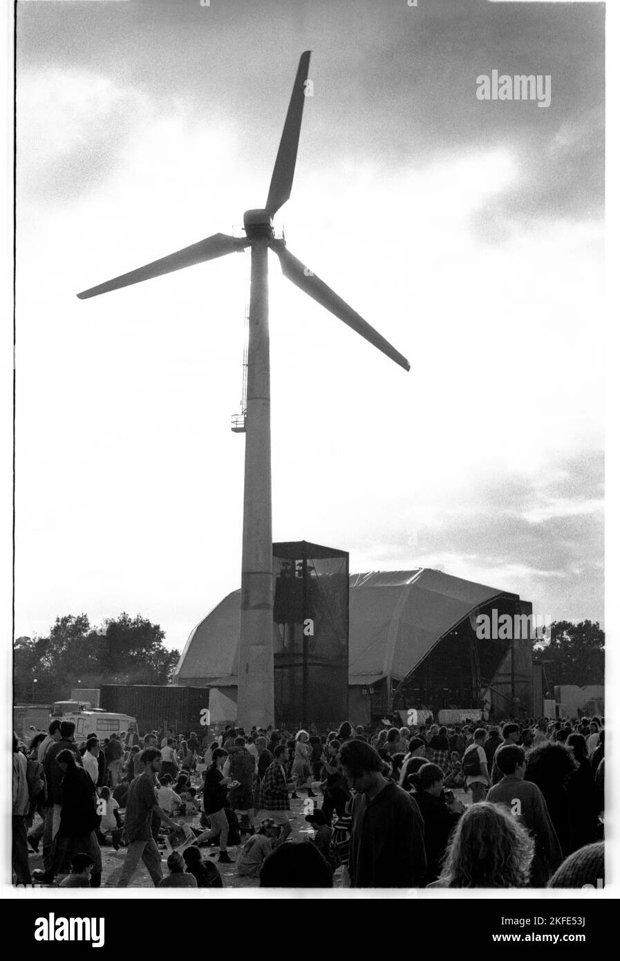 The Main Stage and field at Glastonbury, 24-26 June 1994. There was no Pyramid Stage that year following a fire. This was also the first year a turbine was erected to supply power to the event. Photograph: Rob Watkins Stock Photo
