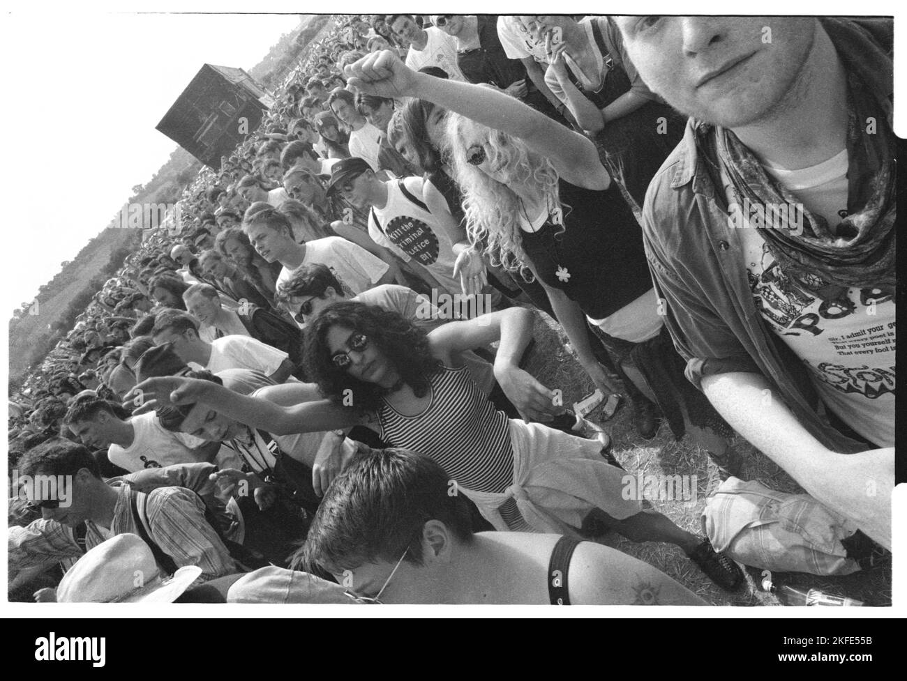 The field and dancing crowd at the NME Stage at Glastonbury, 24-26 June 1994. Photograph © Rob Watkins Stock Photo