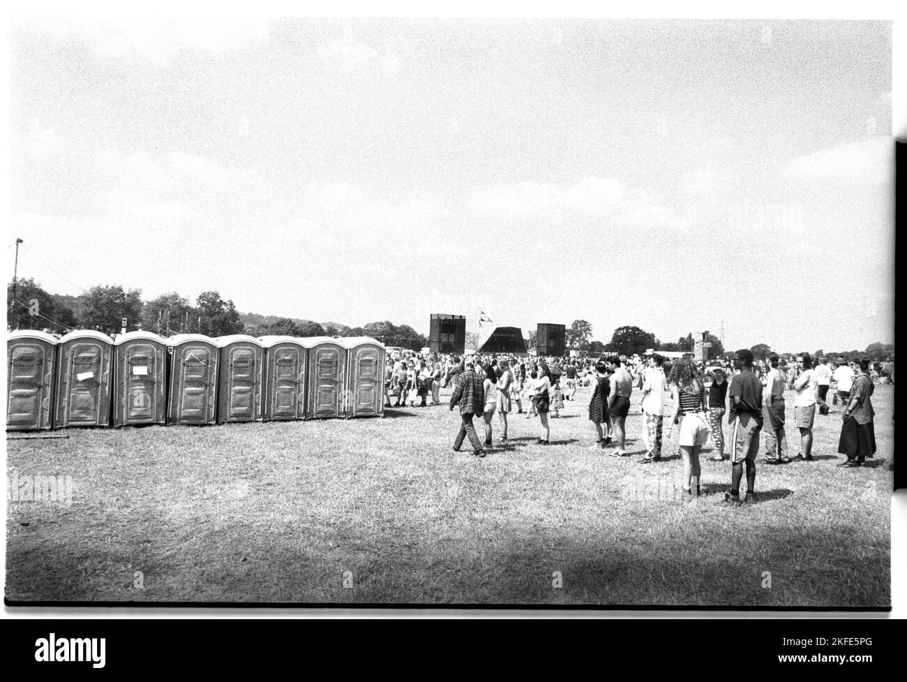 The portable toilets at the side of the Pyramid Stage at Glastonbury Festival, Pilton, England, June 26-28 1992. Photograph: ROB WATKINS Stock Photo