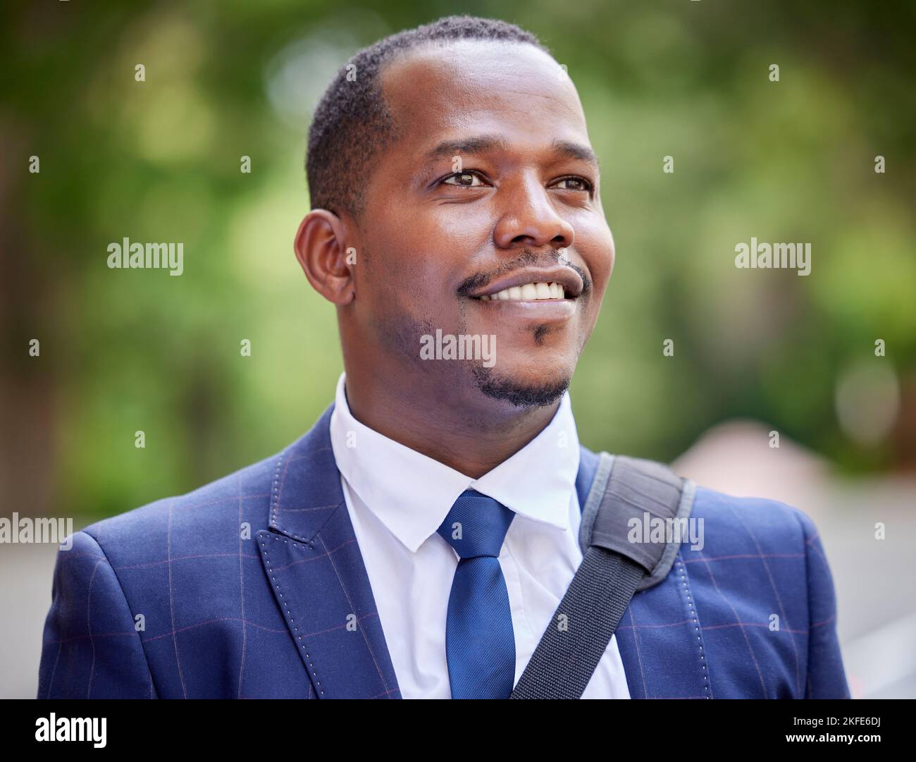Happy black business man in the city, professional entrepreneur commute to work and outdoor in park. Young african lawyer in corporate suit, vision Stock Photo
