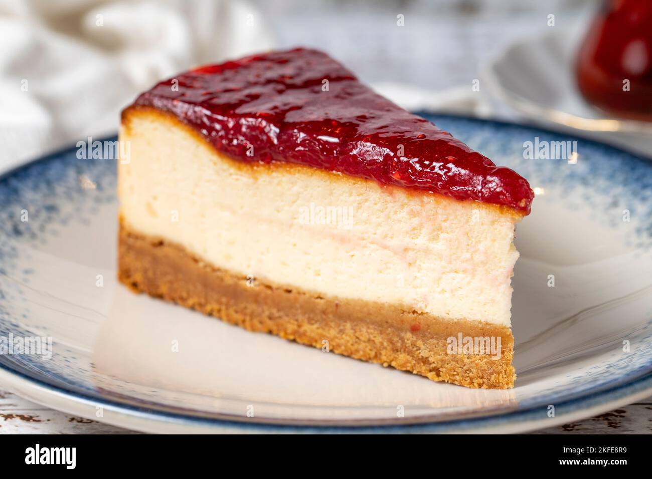 Cheesecake on a white wooden background. New York cake. American food culture. Bakery desserts. close up Stock Photo