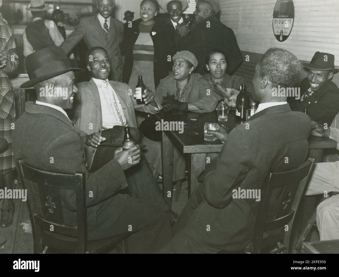 African Americans conversing and drinking beers in a bar, Clarksdale
