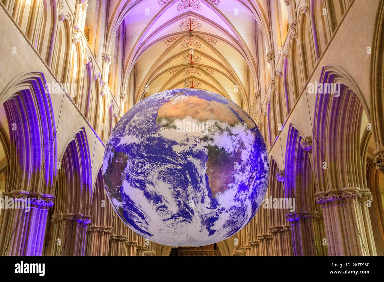 The 'Gaia' art installation, a 7m diameter globe with NASA space images of Earth by Luke Jerram, in the nave of Wells Cathedral, Somerset, England, UK Stock Photo