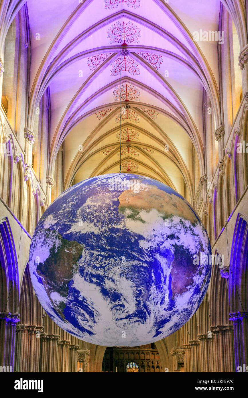 The 'Gaia' art installation, a 7m diameter globe with NASA space images of Earth by Luke Jerram, in the nave of Wells Cathedral, Somerset, England, UK Stock Photo