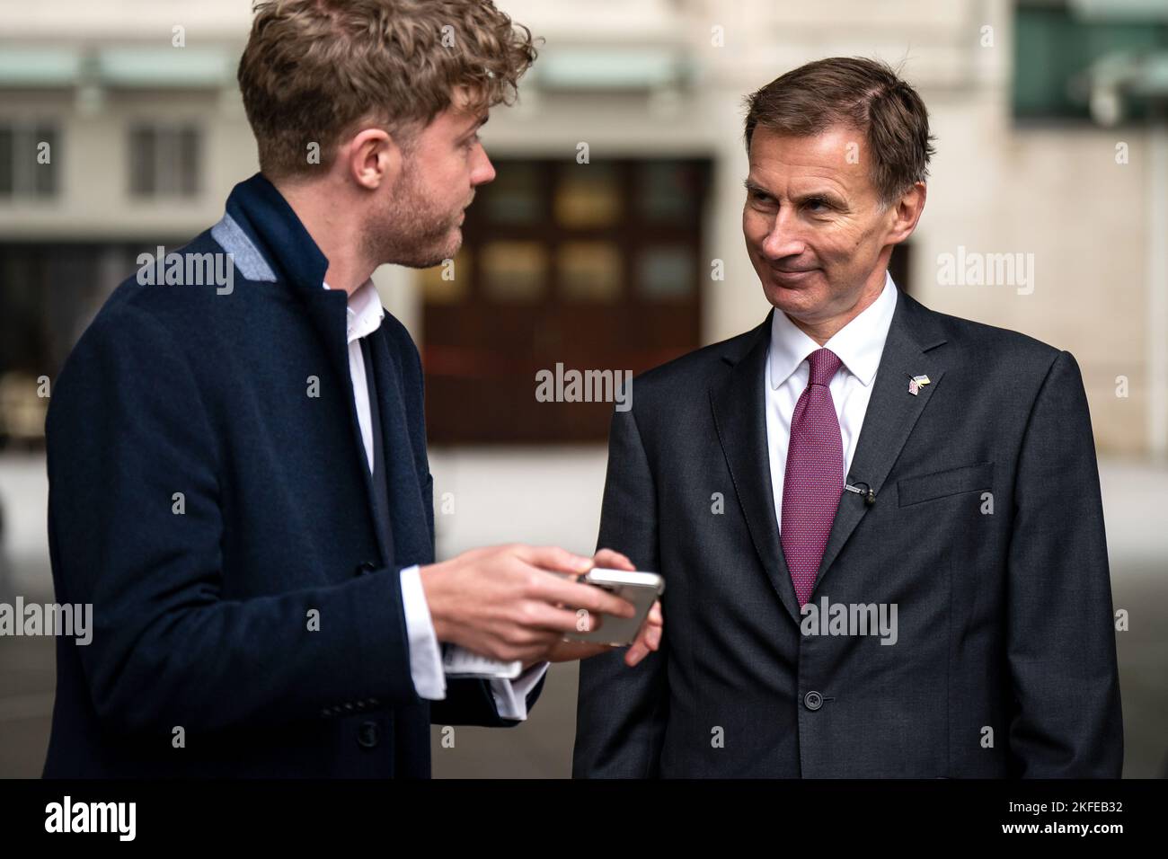 Chancellor of the Exchequer Jeremy Hunt (right) gives a television ...
