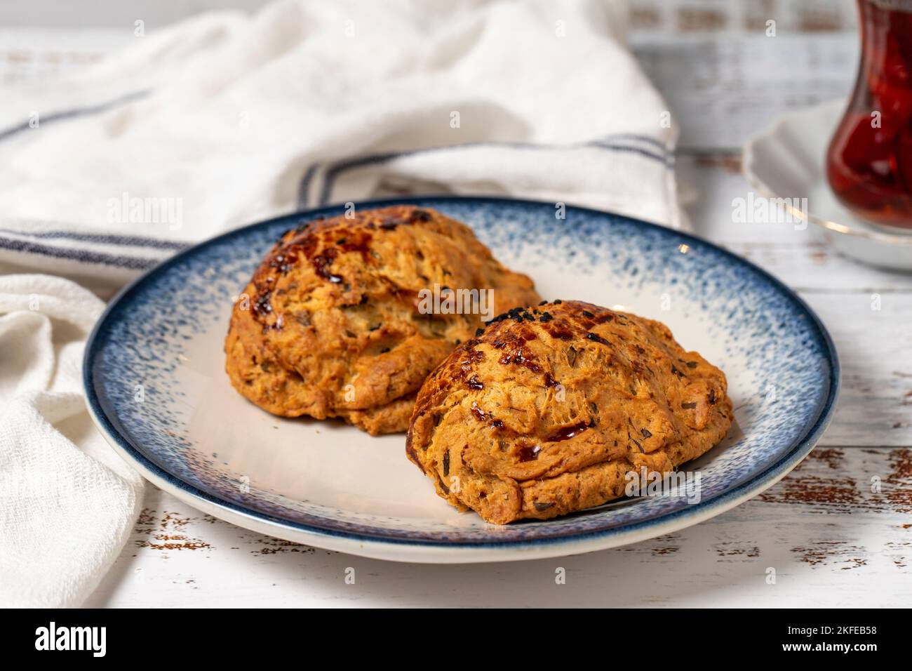 Pogaca with nigella sativa on a white background. Turkish pastry ...