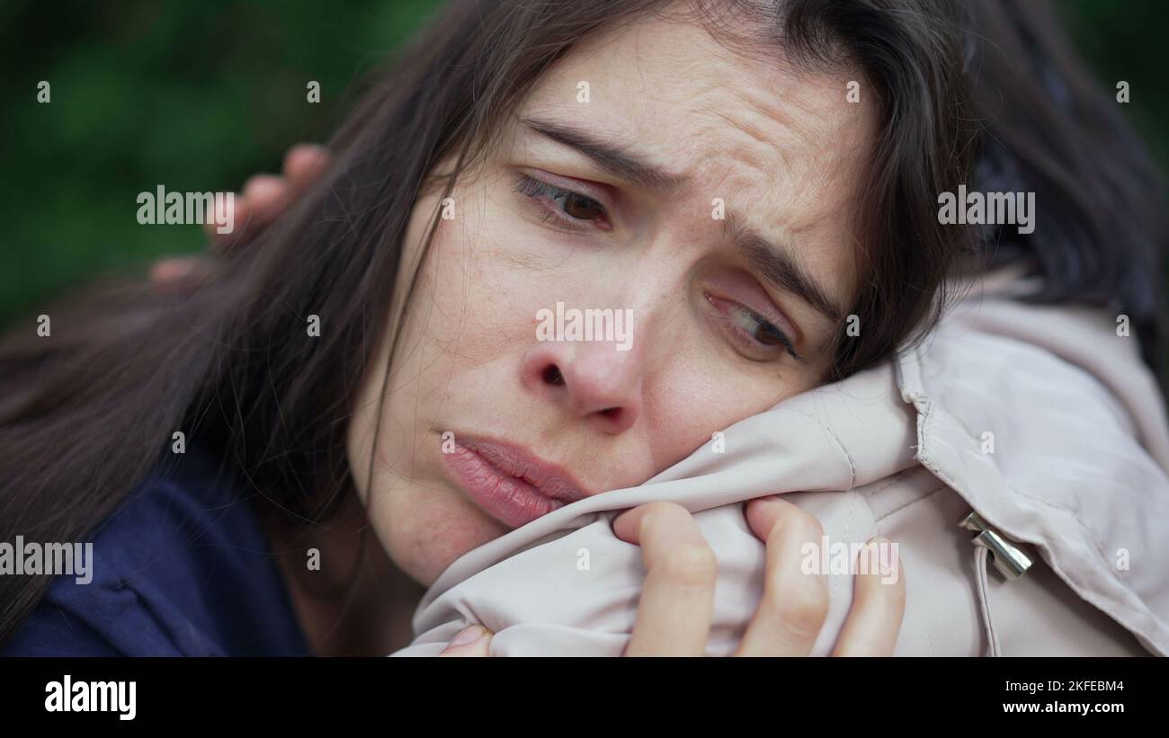 Sad woman suffering from depression crying on friend shoulder ...