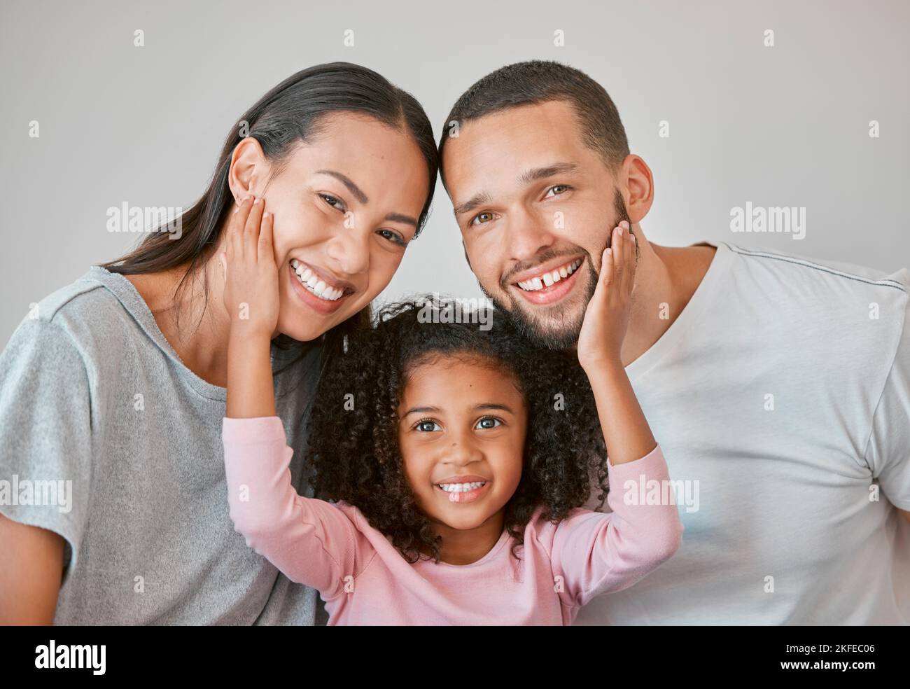 Portrait, girl and parents with happy, love and smile in morning, relax ...