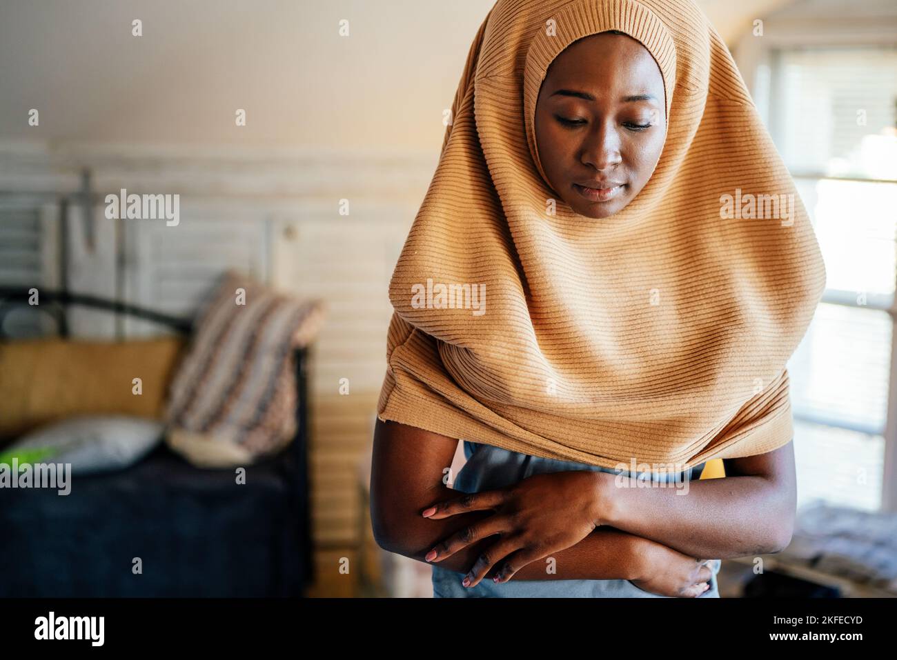 Young muslim black woman praying at home Stock Photo