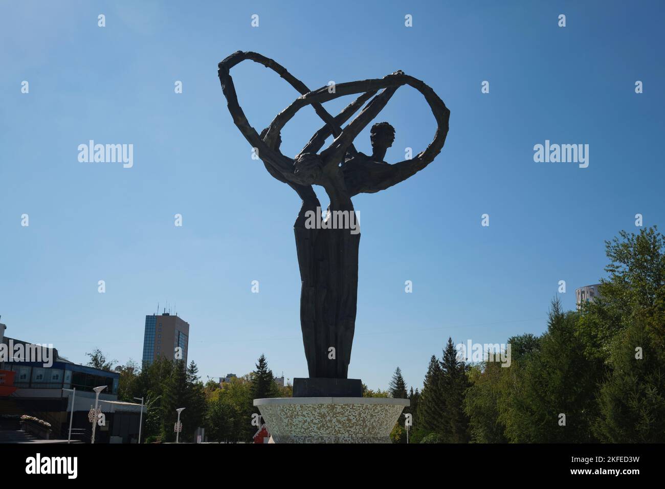 A view of the semi-abstract design of people with interwined arms. At the Friendship Of Peoples Monument statue, sculpture in Astana, Nur Sultan, Kaza Stock Photo