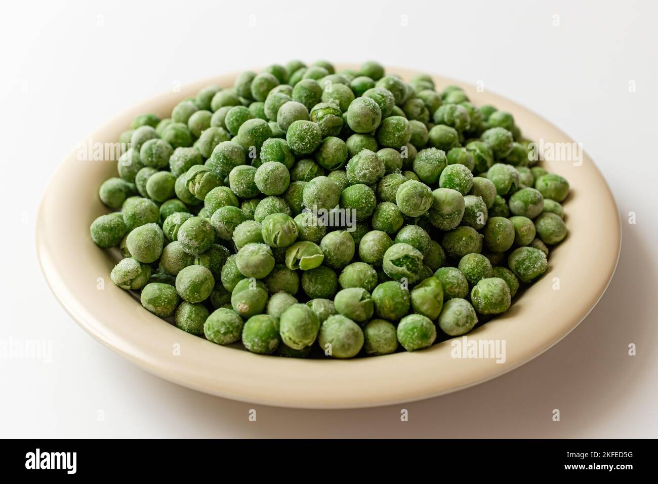 green peas on a white background Stock Photo