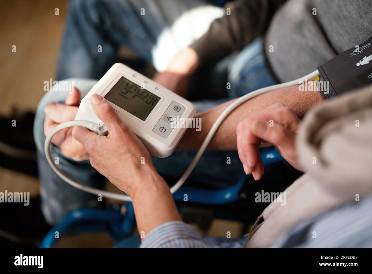 People check blood pressure and heart rate with digital measurement. Healthcare people concept Stock Photo