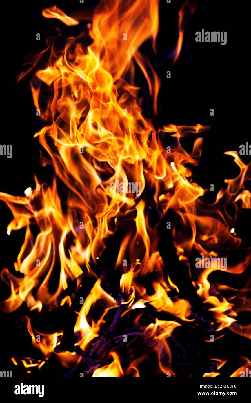 fire burning on a black background. Red fiery flame Stock Photo