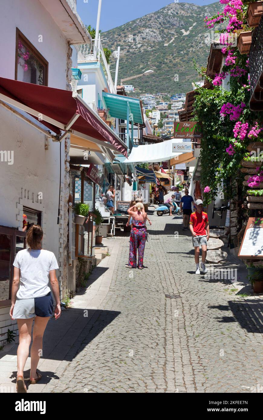 Tourists walk through the streets of Kalkan in Turkey. August 2022 Stock Photo