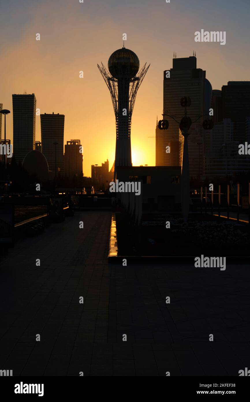 A silhouette view of the iconic Baiterek Tower at dusk, sunset with ...
