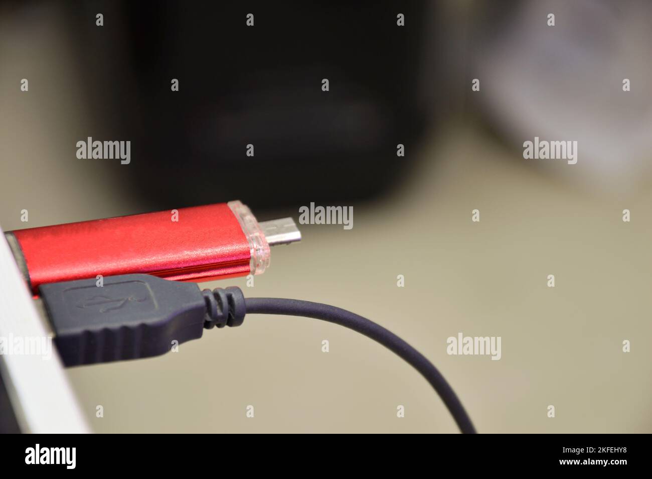 The USB Flash Drive is a storage device, the USB Garage is red Stock