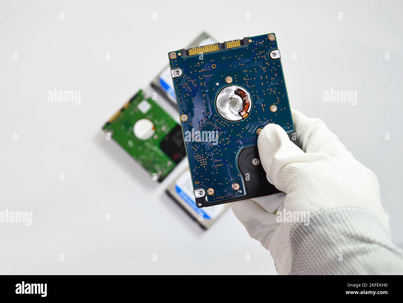 Hard disk drives are still widely used. placed on a white background) Stock Photo