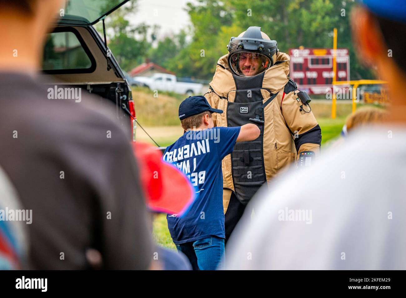 A Harlowtown elementary student tests the bomb suit used by the 341st
