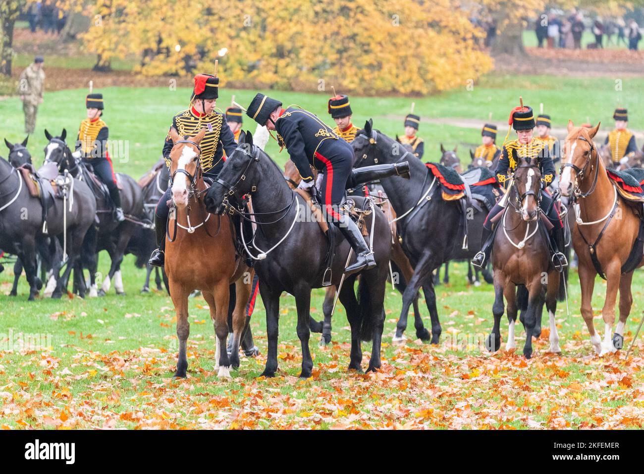 Kings Troop, Royal Horse Artillery carried out a 41 gun salute for the King Charles III's birthday in Green Park, London, UK. Rider mounting a horse Stock Photo